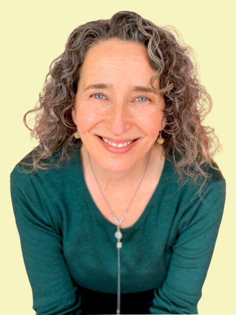 Headshot of Lucrezia with soft yellow background