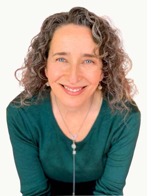 Professional headshot of Lucrezia Mangione with a soft expression, photographed against an off-white background.