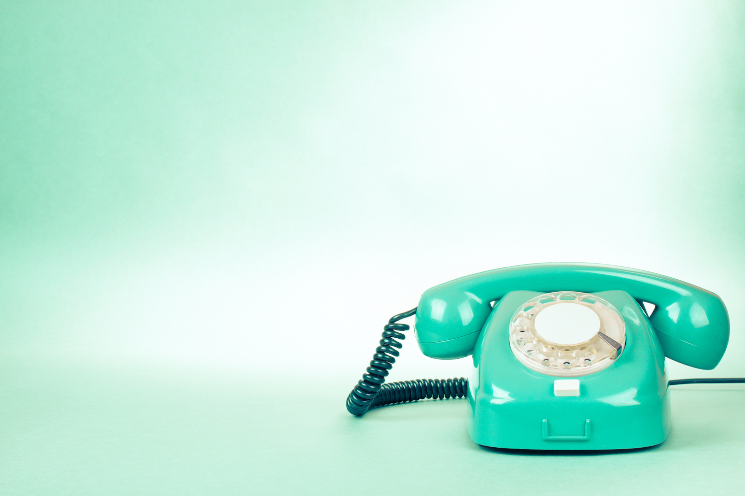 Green phone icon to contact Mind Body Well Therapy for holistic mental health counseling, KAP, and neurofeedback services.